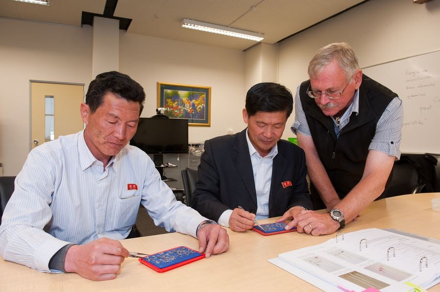 Mr Im Tae Yong and Mr Jon Jong Nam with Professor Hampton