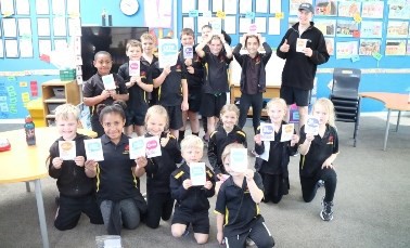 Image: Scholar Tom Shallard with Hororata Primary students.