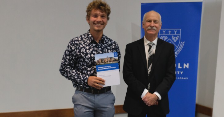 PHOTO: LUSA Research Postgraduate Representative Findal Probst, who helped organise the postgraduate conference and presented a discussion paper during the event, receives his certificate from Acting Vice-Chancellor Professor Bruce McKenzie. 