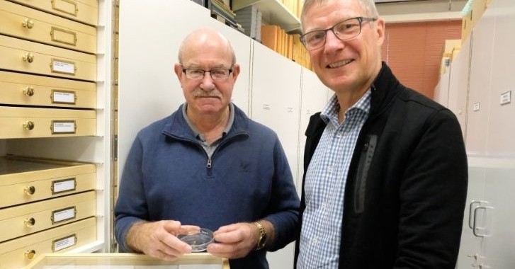PHOTO: Fly collection brings Burns connection to Lincoln - Malcolm Wheeler (left) with the fly specimens he brought to campus and Lincoln University Entomology Collection Curator John Marris.